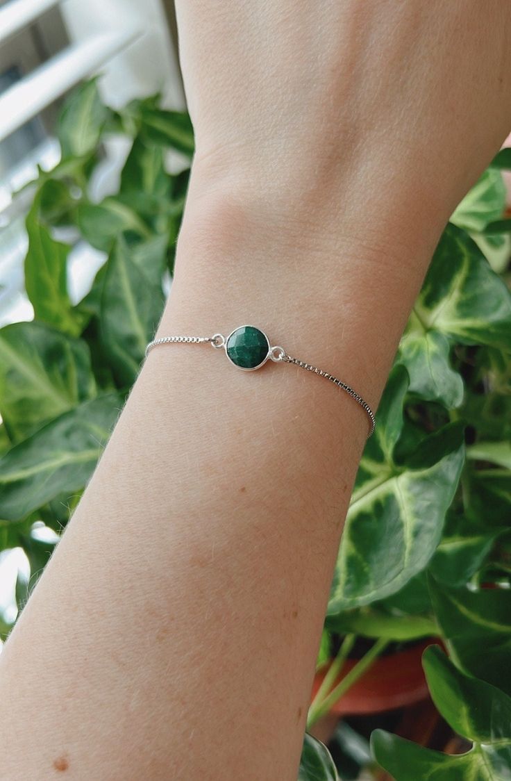 This minimalist style emerald bracelet is perfect for everyday wear. It's beautiful on its own, but also makes a great layering piece. Created with a silver plated natural emerald that is attached to a dainty rhodium plated chain with a slider bead that makes it adjustable. It is finished off with two ball ends. Emerald is the May birthstone. It is often associated with abundance and unity.  All jewelry comes ready to gift in a 100% recycled kraft paper box with eco-fiber filling and an elastic ribbon. Check out some of my other bracelets here https://www.etsy.com/shop/LivinFreely?section_id=14038074 Adjustable Dainty Green Chain Bracelet, Green Round Chain Bracelet Gift, Dainty Green Adjustable Chain Bracelet, Minimalist Adjustable Emerald Jewelry, Everyday Minimalist Emerald Jewelry, Minimalist Green Bracelet, Green Bracelet With Adjustable Chain, Green Chain Bracelet For May Birthstone Gift, Green Bracelets With Adjustable Chain