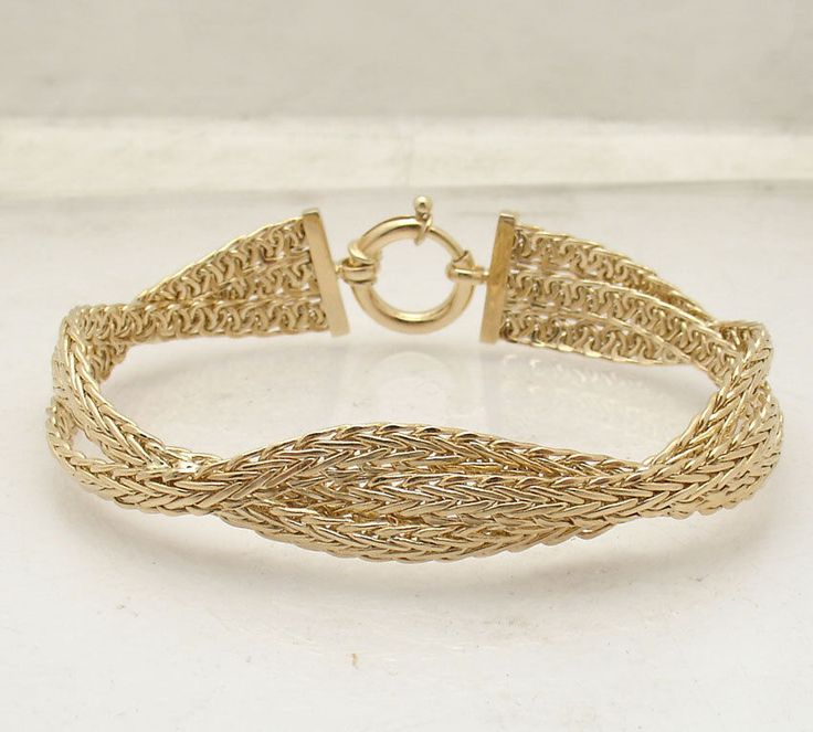 Click image to Enlarge 7.25" Triple Woven Wheat Spiga Chain Link Bracelet Real 14K Yellow Gold Sevilla HSN  Metal Condition Finish Avg. Weight Width Length Clasp Retail Price Real 14K Yellow Gold (Properly Stamped 14K) Brand New Polished 9.40grams 8mm= 5/16" 7.25" Spring Ring Clasp $990     Sevilla Gold 14K Braided Wheat Chain Bracelet  on air for $639.95  455-167 The only thing better than one elegant gold chain? Three of them! Braided together to form this handsome bracelet, lovely wheat links Chain Link Bracelet, Spring Rings, Link Bracelets, Chain Bracelet, Gold Chain, Chain Link, Gold Chains, Yellow Gold, Chain