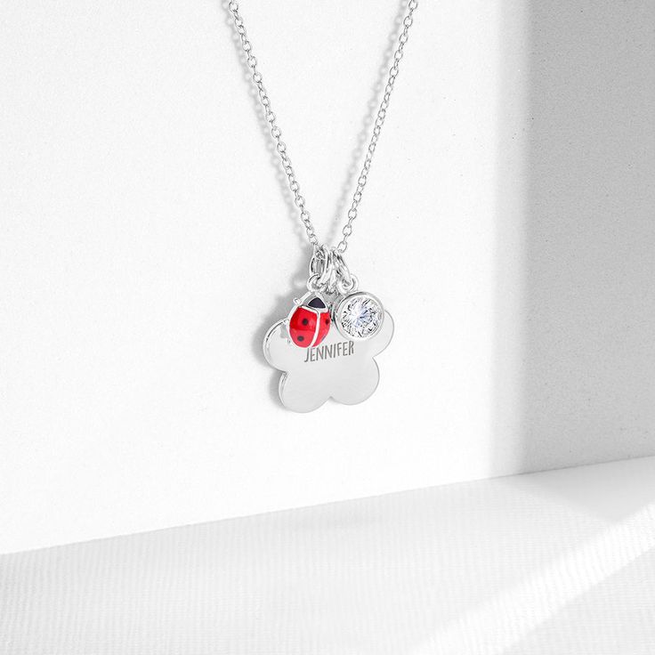 This unique flower pendant necklace will make for a beautiful and meaningful gift for a young girls special birthday celebration. A polished necklace that can be engraved to feature a young girls name or initials. This pendant comes with a matching hypoallergenic chain, with a 2" extension to adjust to a comfortable length. This item will be delivered neatly packaged in a gift box for your convenience. Age Group: Lovely Fit for Little Girls or Pre-Teens; Safe for Sensitive Skin Material: 925 Ste Charming Flower Charm Necklaces For Gift, Charming Flower Charm Necklace Gift, Anniversary Flower Charm Pendant Necklace, Mother's Day Charm Necklace With Initial Pendant Flower Charm, Mother's Day Charm Necklace With Flower And Initial Pendant, Mother's Day Necklaces With Flower Pendant Charms, Mother's Day Flower Charm Necklace With Initial Pendant, Mother's Day Flower Charm Initial Pendant Necklace, Mother's Day Flower Pendant Necklaces With Charms