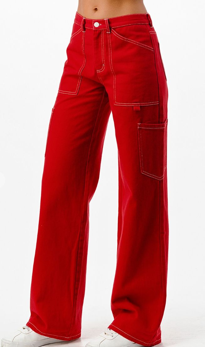 Colored cargo pants with white contrasting white stitching and a straight leg fit. Red Pants Women, Full Red Outfit, Red Cargo Pants Outfit, Barrel Costume, Red Cargos, Cotton Pants Outfit, Red Jeans Outfit, Caro Pants, Colored Cargo Pants