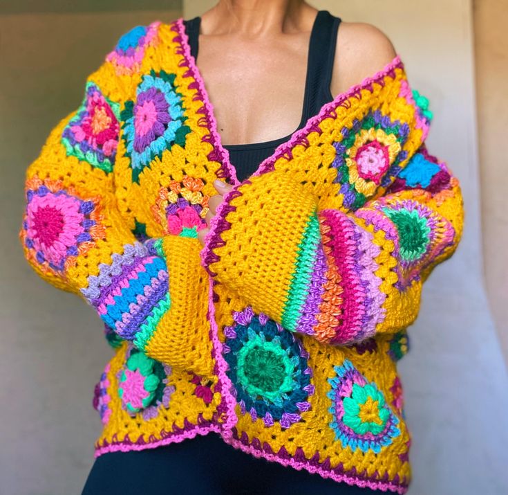 - Only 1 available, ready to ship - Every granny square is different and unique - Size M/L (length 61cm/24in, width armpit to armpit 67cm/26.4in, sleeve width 20cm/7.9in) - Oversized fit - Open front/no closure - Many colorful details  - Soft and cozy - Machine washable in cold temperature 30*C If you have any questions please contact me:) Bohemian Multicolor Granny Square Patterns, Bohemian Multicolor Crochet Lace Patterns, Handmade Bohemian Patterns For Spring, Bohemian Multicolor Patterns For Crafting, Handmade Multicolor Patterns For Festival, Multicolor Bohemian Patterns For Crafting, Hippie Crochet Festival Cardigan, Handmade Bohemian Patterns For Festival, Bohemian Granny Square Patterns For Spring