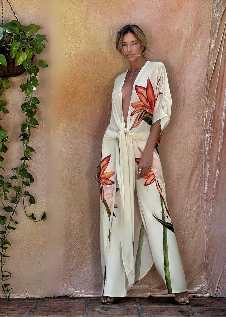 Erte Kaftan Bird of Paradise – Ramona LaRue Chic White Kaftan For Beach Season, Elegant Beachwear Sets For Summer, Elegant Beach Sets For Summer, White Sets With Kimono Sleeves For Spring, Elegant Long Sleeve Summer Swimwear, Elegant Long Sleeve Swimwear For Summer, White Spring Sets With Kimono Sleeves, White Long Sleeve Beach Set, Tropical V-neck Kimono For Summer