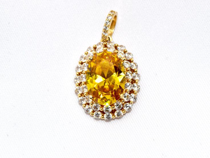 Stunning yellow stone pendant with yellow zirconia. Perfect for fashion and everyday use. 14KT of Gold. Gold Oval Jewelry With Sparkling Stones, Oval Gold Jewelry With Sparkling Stones, Luxury Yellow Sapphire Jewelry With Diamond Accents, Fine Jewelry With Yellow Sapphire, Fine Jewelry Yellow Pendant, Yellow Jewelry With Diamond Accents, Yellow Pendant Fine Jewelry, Yellow Sapphire Fine Jewelry, Luxury Yellow Oval Jewelry