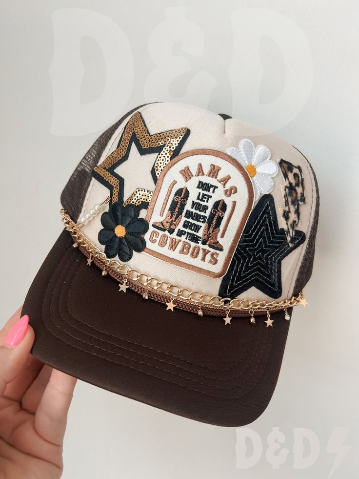 This custom made trucker patch hat is perfect for any occasion whether it be for spring/summer time, a lake hat, a gift for someone, or just a cute accessory to add a little spice to your outfit 🧢✨ DETAILS-  * This hat is one size with an adjustable SnapBack that is adjustable from 20in. - 23.5in. * The color of this hat is Tan & Brown * The material of the hat is polyester with iron on patches  NOTICE OF NON-AFFILIATION AND DISCLAIMER: We are not affiliated, associated, authorized, endorsed by, or in any way officially connected with the brand shown or any of its subsidiaries or its affiliates. All related names, marks, emblems and images are registered trademarks of their respective owners. These are not official merchandise. REFUNDS AND CANCELLATIONS- Every hat is handmade by me as a r College Trucker Hat, Cute Trucker Hat Outfits, Hat Patches Diy, Patch Hats Baseball Caps, Trucker Baseball Cap With Flat Brim For Festival, Festival Trucker Cap With Flat Brim, Trucker Flat Brim Baseball Cap For Festivals, Trucker Style Flat Brim Baseball Cap For Festivals, Festival Trucker Baseball Cap