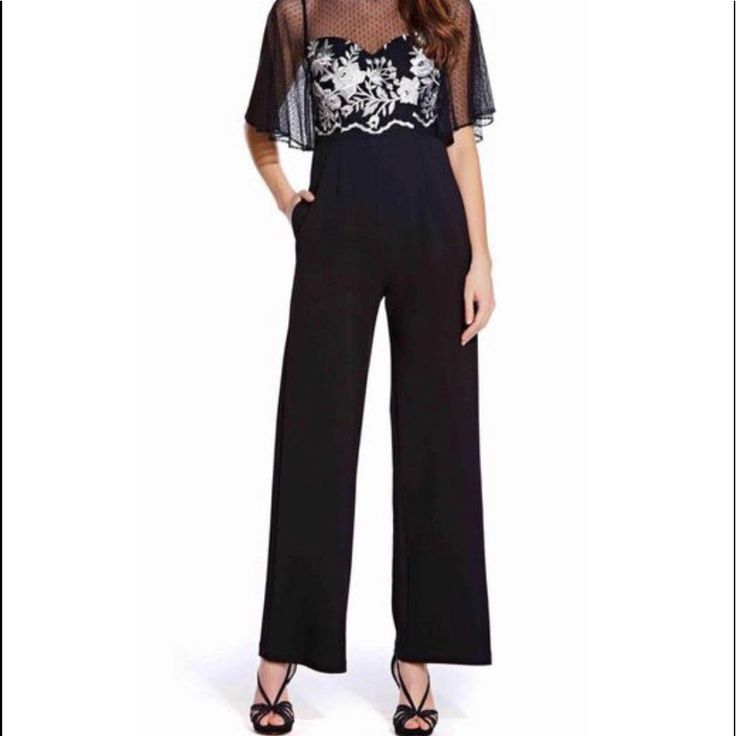 Adrianna Papell Ap1e205755 Flared Sleeve Embroidered Mesh Jumpsuit In Black Size 4. Has A Bateau Neckline With Flutter Sleeves. The Fitted Bodice Is Designed With Floral Embroidery. The Back Has A Zipper Closure While The Full Length Leg Pants Are Styled With Pockets. Fitted Embroidered Jumpsuit For Festive Occasions, Embroidered Fitted Jumpsuits And Rompers For Festive Occasions, Festive Embroidered Fitted Jumpsuits And Rompers, Chic Evening Jumpsuits And Rompers For Festive Occasions, Festive Formal Jumpsuits And Rompers, Elegant Embroidered Jumpsuits And Rompers For Party, Festive Chic Fitted Jumpsuits And Rompers, Elegant Embellished Jumpsuits And Rompers For Festive Season, Elegant Floral Embroidered Pants For Party