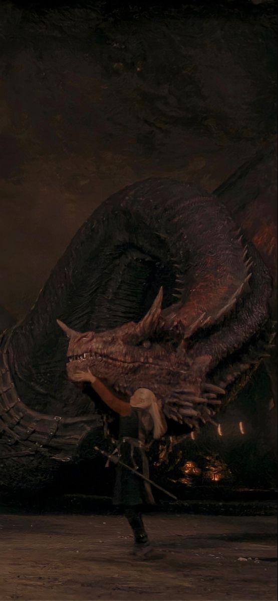 a man standing next to a giant dragon