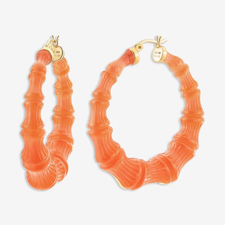 WHEN YOU NEED A VACATION WHAT IT IS: A chic pop of colorWHY IT’S SPECIAL: If you're looking for the perfect orange, you've found it! Colorful but easy to wear, these hoops add just the right pop of color. The details in the bamboo design elevate these to a notch above your average hoops GOOD TO KNOW: Handcrafted Lucite 14K Gold plated, sterling silver posts Size: 2" Due to their handmade nature, each piece is unique WHY WE LOVE GOLD AND HONEY: These four sisters bridge the gap between fashion an Trendy Small Hoop Orange Earrings, Trendy Small Hoop Orange Jewelry, Trendy Orange Round Earrings, Orange Small Hoop Earrings For Summer, Summer Orange Small Hoop Earrings, Summer Orange Hoop Jewelry, Casual Orange Earrings, Orange Small Hoop Summer Jewelry, Orange Small Hoop Jewelry For Summer