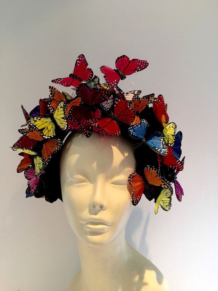 NYC Fascinator- Derby Hat -Monarch Headband- Butterfly Headpiece- Hair Accessory- Mad Hatter- Insect Headband Hi. This butterfly headband/fascinator is made with multi color feather butterflies that are perched on a 5 black roses. The piece is about 7 inches high by 7 inches wide. Each butterfly is hand glued (wing by wing) in the back for extra support and makes it more durable than most butterfly headpieces. The fascinator is on a 1 inch matching covered headband that is adjustable to fit any Summer Carnival Headband Headpieces, Carnival Summer Headband Costume Hat, Summer Carnival Costume Headband, Multicolor Carnival Headband Fascinator, Whimsical Multicolor Headband For Summer, Adjustable Multicolor Fascinator For Carnival, Multicolor Carnival Headband Costume, Multicolor Feather Fascinator For Kentucky Derby, Multicolor Feathered Fascinator For Kentucky Derby