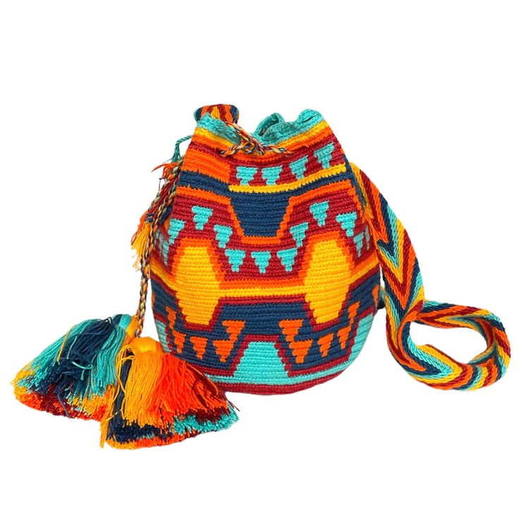 Colorful & unique crochet bag! Very lightweight, durable and comfortable to carry on. Wear it as a cross-body or shoulder bag. This stunning boho style bag is perfect for a casual day, as a beach/pool accessory or as a complement to your sports outfit. Details: Medium Size Bucket Bag Style Desert Sunset Colors (Yellow, Orange, Navy, Burgundy) Traditional indigenous symbology pattern. Matching hand-woven strap with zig-zag pattern Drawstring closure with tassels Material: Made from cotton threads Multicolor Bucket Bag With Adjustable Strap For Vacation, Multicolor Vacation Bucket Bag With Adjustable Strap, Multicolor Bucket Bag With Adjustable Strap For Beach, Multicolor Adjustable Strap Bucket Bag For Beach, Colorful Casual Crochet Bag For Vacation, Bohemian Crochet Bucket Bag For Everyday Use, Multicolor Bohemian Bucket Bag For Everyday Use, Bohemian Multicolor Bucket Bag For Travel, Crochet Bucket Beach Bag For Travel