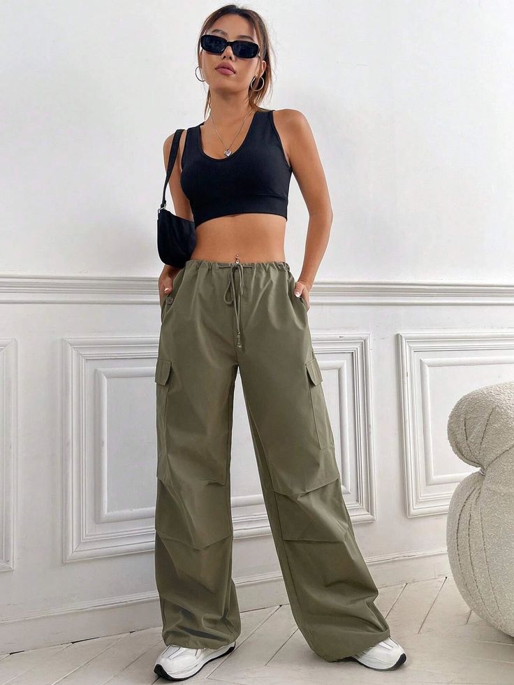 Elevate your casual style with our Flap Pocket Side Drawstring Waist Cargo Pants. Crafted from durable woven fabric, these long-length cargo pants feature a loose fit for ultimate comfort. The drawstring waist allows for a customizable fit, while the drop waist adds a trendy touch. With ample pockets and a non-stretch composition, these pants are both functional and fashionable. Details: Type: Cargo Pants Closure Type: Drawstring Waist Details: Drawstring, Pocket Waist Line: Drop Waist Length: L Casual Summer Cargo Pants With Functional Drawstring, Green Wide Leg Cargo Pants With Drawstring, Casual Green Cargo Pants With Drawstring, Utility Khaki Bottoms With Functional Drawstring, Casual Wide Leg Parachute Pants With Drawstring, Casual Baggy Cargo Pants With Drawstring, Baggy Casual Cargo Pants With Drawstring, Casual Baggy Cargo Pants With Functional Drawstring, Khaki Wide-leg Cargo Pants With Elastic Waistband