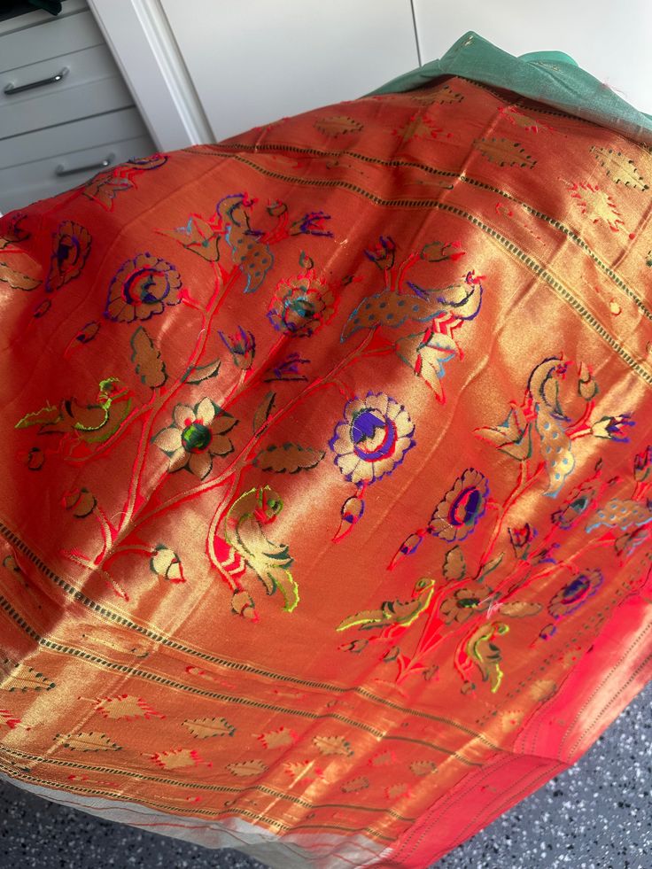 This Muniya border paithani saree from Pure Paithani is an exquisite choice for any special occasion. Its intricate embroidery is skillfully crafted, adding a traditional touch to your wardrobe. It is a perfect way to embody grace and sophistication. fall & pico done blouse size 38-42 Multicolor Paithani Silk Pre-draped Saree For Navratri, Festival Paithani Silk Pre-draped Saree With Zari Work, Paithani Silk Pre-draped Saree For Traditional Ceremonies, Bollywood Style Paithani Silk Pre-draped Saree For Puja, Red Paithani Silk Pre-draped Saree For Puja, Festive Pre-draped Saree In Paithani Silk With Traditional Patterns, Semi-stitched Paithani Silk Dupatta For Puja, Dola Silk Pre-draped Saree With Embroidered Border For Puja, Paithani Silk Pre-draped Saree With Traditional Patterns