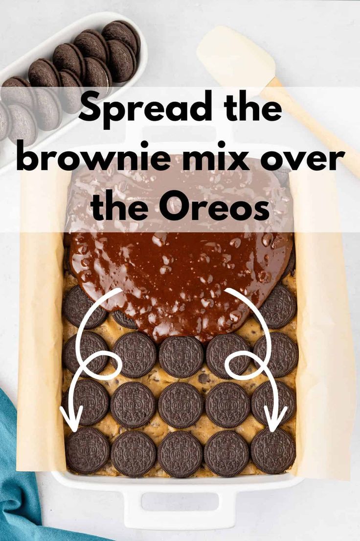 an overhead view of a brownie mix over the oreos in a baking dish