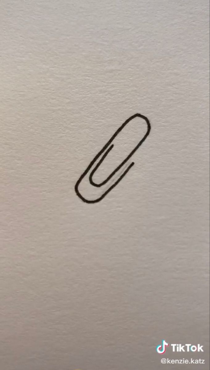 a drawing of a paperclip on the back of a white laptop computer screen