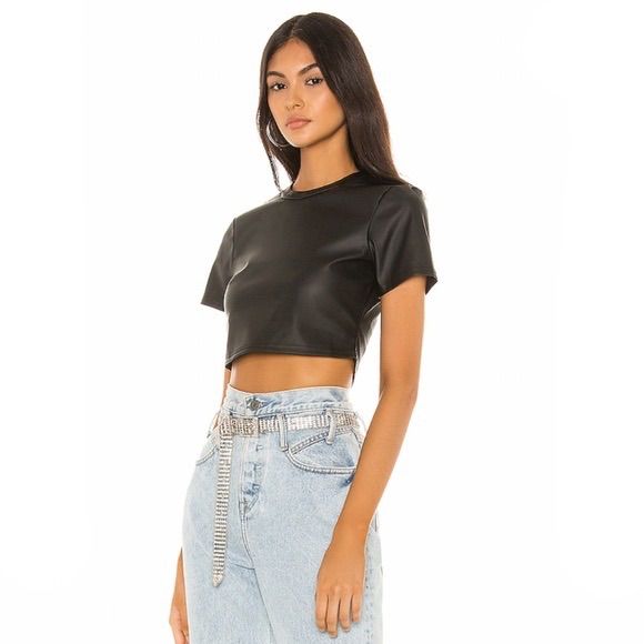 From Revolve Details: Size: M Black Short Sleeve Crew Neck Crop Top Super Versatile Faux Leather Fabric. Hidden Back Zipper Closure Trendy, Crop, Daybreaker, 55% Polyurethane, 45% Poly. ** No Tag, But Has Never Never Worn. Smoke & Pet Free Home!! Chic Fitted Faux Leather Tops, Trendy Fitted Faux Leather Top, Black Faux Leather Top For Club, Trendy Fitted Faux Leather Tops, Black Faux Leather Club Top, Trendy Faux Leather Tops For Night Out, Edgy Fitted Faux Leather Top, Fitted Faux Leather Edgy Tops, Spring Faux Leather Tops For Night Out