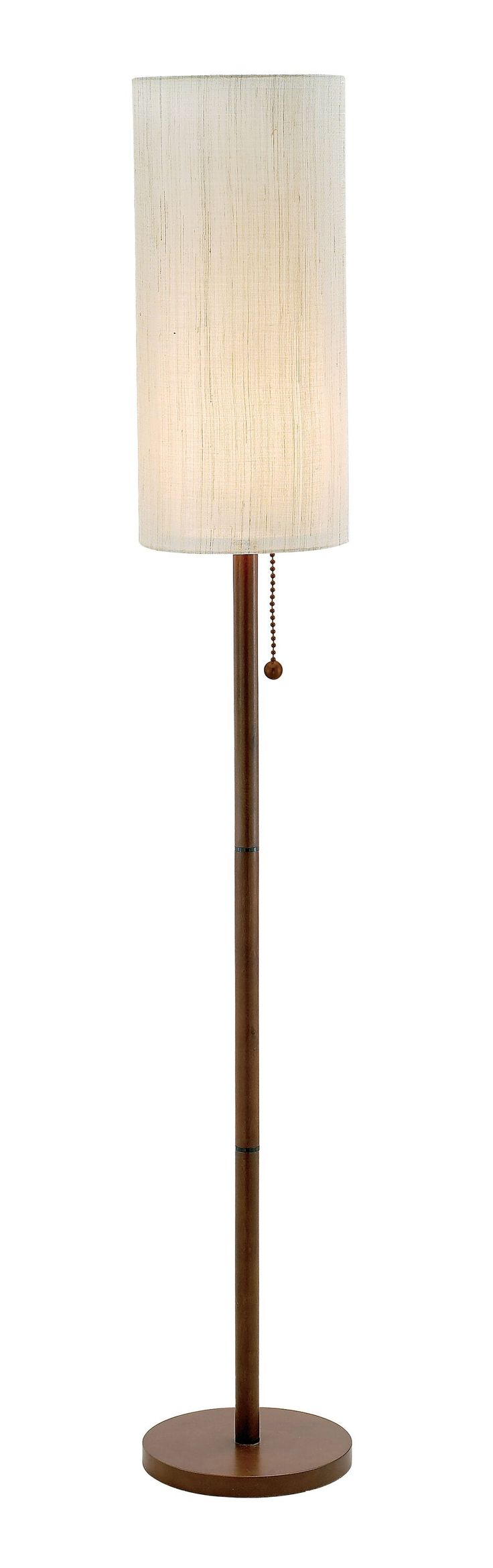 a lamp that is on top of a wooden stand with a white shade over it