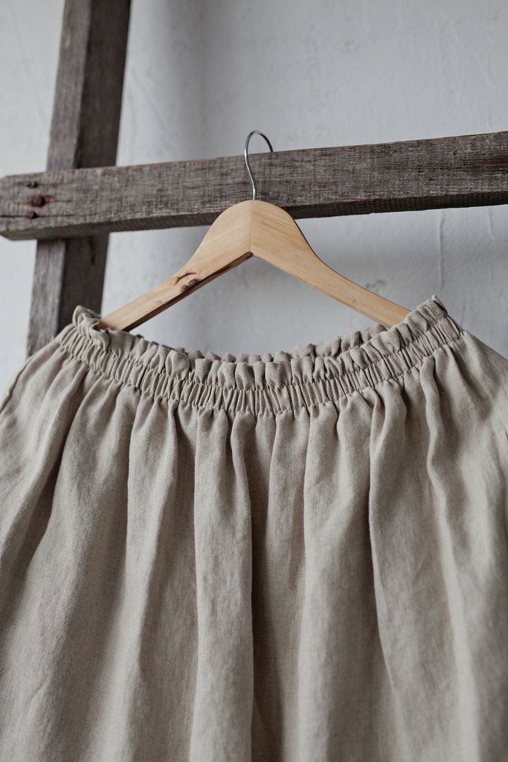 Below the knee skirt is made from 100% soft and washed linen. This Petticoat is perfect for wearing under dress or other skirt or can be worn alone. Match it with our tunics! Details: - Composition: 100% Oeko-Tex certified linen - Colour: natural - Elastic waist - Pockets - Size: One size/fits all - Medium weight linen - Linen care: machine wash gentle; tumble dry low, ironing optional - The price is for one skirt, other pictured items are not included Beige Skirt With Elastic Waistband And Relaxed Fit, Linen Mini Skirt For Summer, Linen Mini Skirt With Relaxed Fit For Spring, Long Linen Skirt With Elastic Waistband, Flowy Linen Skirt With Elastic Waistband, Relaxed Linen Mini Skirt For Spring, Summer Linen Maxi Skirt With Elastic Waistband, Linen Pleated Skirt Bottoms, Summer Tiered Linen Skirt