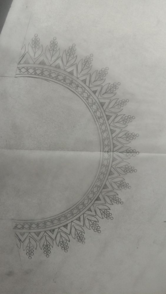 a drawing of a circular design on paper