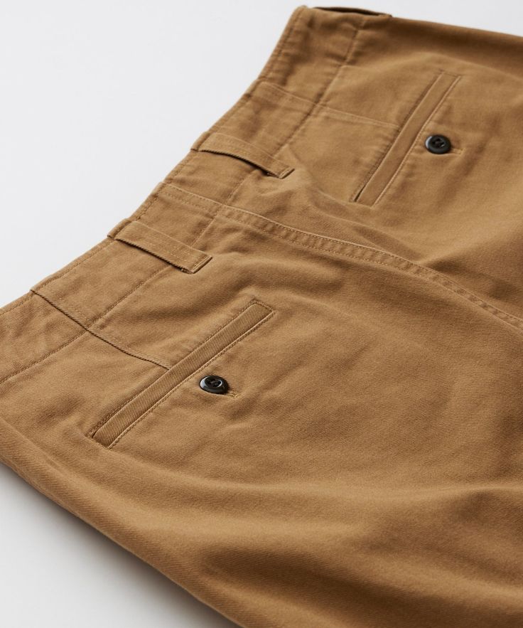 If you want the perfect chino, sometimes you have to design it yourself. From the fabric to the fit, Todd carefully considered every element in order to create a pair of pants that feels like an old favorite from the very first wear. So, what makes a chino a chino — or more importantly, what makes our chino your new Fa Brown Chino Cotton Twill Bottoms With Welt Pockets, Brown Cotton Straight Leg Chinos, Brown Straight Leg Cotton Chinos, Classic Brown Chino Cotton Twill Bottoms, Brown Tapered Leg Chinos With Welt Pockets, Classic Brown Relaxed Fit Chinos, Brown Cotton Flat Front Pants, Brown Flat Front Cotton Pants, Classic Brown Cotton Chinos