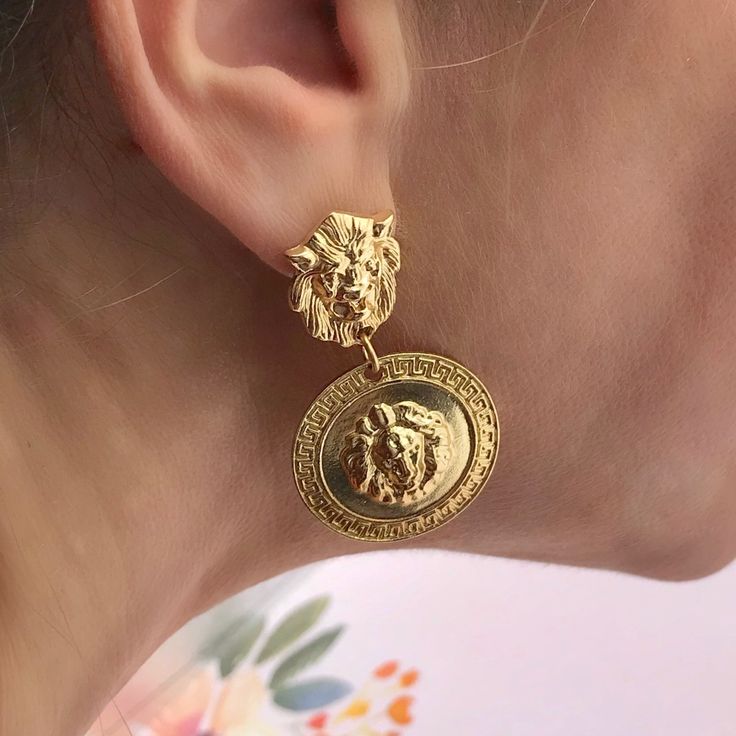 Gold Lion Aztecs Shield Earrings Nwot These Stunning Earrings Will Make Any Outfit Stand Out In A Crowd. Earrings Feature A Lion Head Pierced Tension Backs With Lion Shields And Aztecs Border. Gold Plated Metal Alloy Fashion Jewelry. Great And Comfortable For All Day Wearing. Earrings Are 2” Long And 1” Wide Lion Jewelry Woman, Lion Earrings, Headpiece Jewelry, Gold Lion, Earrings Aesthetic, A Lion, Lion Head, Stunning Earrings, Cute Earrings