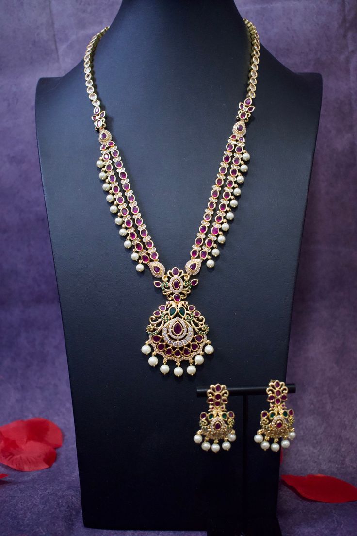 Embrace the cultural opulence of Real Kemp Gold Finish Long Ethnic Necklace, where each necklace set is a work of art. Whether you're a bride adorning yourself for your wedding day, attending cultural events, or celebrating important occasions, this necklace set promises to adorn you with grace and the timeless charm of Indian bridal jewelry. Elevate your bridal or cultural look with regal elegance - order yours now! Here are some of the best ways to care for your artificial jewelry: *Keep it dr Bohemian Kundan Necklace With Intricate Design For Wedding, Bohemian Temple Necklace For Diwali Wedding, Bohemian Temple Necklace For Wedding And Diwali, Bohemian Chandbali Necklaces For Wedding, Elegant Bridal Necklace With Peacock Design For Rituals, Elegant Heavy Bridal Necklace For Rituals, Bohemian Style Temple Necklace With Meenakari For Wedding, Bohemian Temple Necklace With Meenakari For Wedding, Bohemian Jewelry Sets With Intricate Design For Wedding