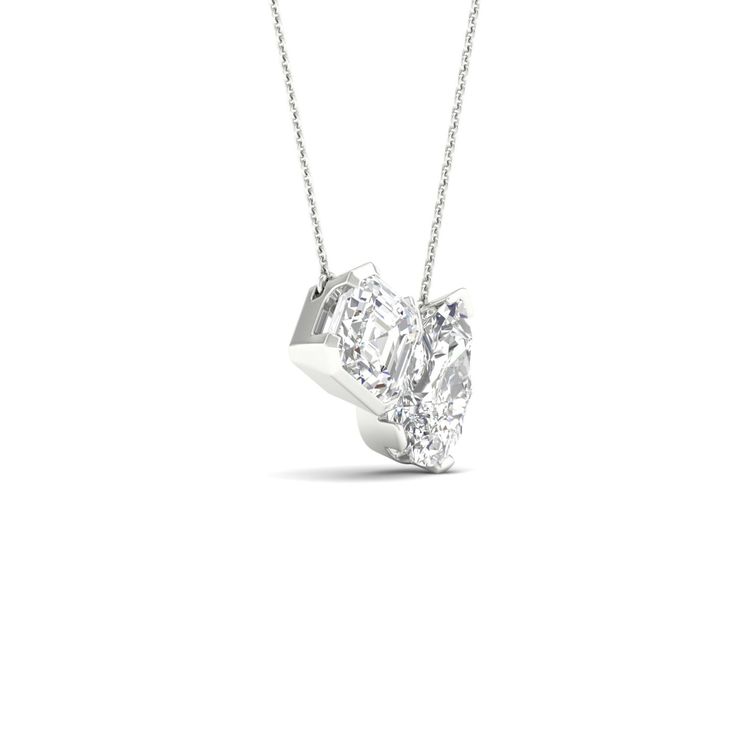 This Toi et Moi necklace features a cushion-cut and a pear-cut diamond, each with a unique charm. The design is elegantly simple with high-quality metal, allowing the two stones to take center stage. Whether you're celebrating an anniversary, or birthday or simply expressing your love, this two-stone necklace is a meaningful and enduring gesture. Modern Pear-shaped Diamond Cut Jewelry, Modern Teardrop Necklace For Anniversary, White Radiant Cut Diamond Jewelry, Modern Diamond Cut Necklace For Anniversary, Sterling Silver Cushion Cut Wedding Necklaces, Radiant Cut Solitaire Necklace For Anniversary, Cushion Cut Diamond White Necklace For Anniversary, Sterling Silver Cushion Cut Necklace For Wedding, Anniversary Necklace With Radiant Cut Diamond Accents