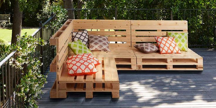 a wooden bench sitting on top of a wooden deck