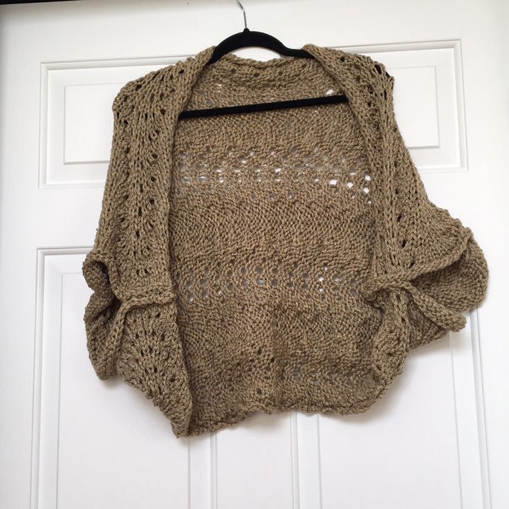 a sweater hanging on a door hanger