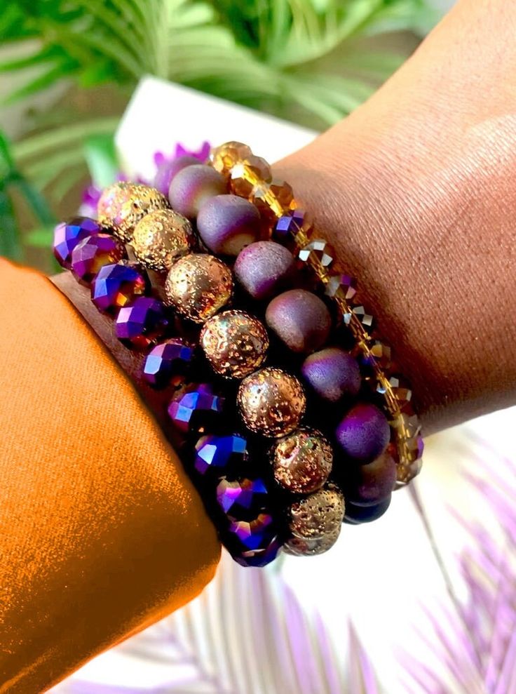 "\"Navya\" This bead bracelet set features a majestic purple and gold mix of iridescent druzy, mystic lava stone, and crystal beads. This set is so alluring! 4 Stretch Bracelets Fits a 6 3/4\"-7 1/4\" Wrist Purple Druzy Bracelet, Lava Stone Bead Bracelet, Crystal Beads Bracelet, Purple Bead Bracelet, Purple Crystal Bracelet, Gold Bead Bracelet, Gold Stretch Bracelet" Purple Crystal Bracelet, Purple Beaded Bracelets, Gold Stretch Bracelet, Memory Wire Wrap Bracelets, Druzy Bracelet, Wire Wrapped Bracelet, Gold Bead Bracelets, Crystal Beads Bracelet, Betsey Johnson Jewelry