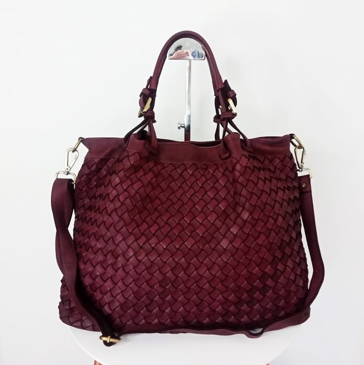 "Soft Red Wine Woven Italian Leather Tote Bag, Customizable, Red Wine Woven Italian Handbag, Italian Leather Bag, Woven Leather Purse, Elow, comes in two versions: LARGE: W 15\" x H 11.4\" x D 7.1\"  & SMALL: W 13\" x H 10\" x D 6\". Handle drop: 4\" The bag has made in distressed soft cowhide and distressed brass hardware We offer a free customization for monogramming Inside: Two compartments inside with central divider/ zippered pocket Interior fully lined with cotton fabric One zippered pocke Luxury Red Shoulder Bag With Intrecciato Weave, Luxury Burgundy Crossbody Bag, Luxury Burgundy Shoulder Bag With Adjustable Strap, Red Crossbody Bucket Bag With Leather Handles, Burgundy Satchel Shoulder Bag For Travel, Burgundy Travel Satchel Shoulder Bag, Travel Burgundy Satchel Shoulder Bag, Burgundy Shoulder Bag Satchel For Travel, Burgundy Tote Bag For Travel