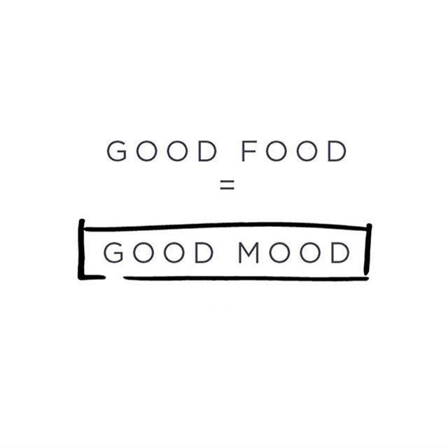 the words good food = good mood are written in black ink on a white background