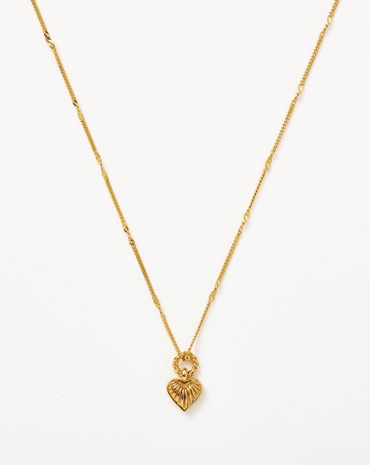 Mini Ridge Heart Charm Pendant Necklace 18ct Gold Plated Vermeil. Inspired by Our Iconic Ridge Heart Charm Necklace – Spotted in the Barbie Movie – Now in a Brand-New Mini Size. Paired with a Delicate Chain, the Mini Gold Puffed Heart Pendant Features Signature Ridge Detailing and a Twisted Rope Jump Ring. Layer with Longer Necklaces or a Delicate Choker. Shop the Ridge Heart Charm Necklace. Pendant Metal: 18Ct Gold Plated on Brass Chain Metal: 18Ct Gold Plated Vermeil on Sterling Silver Charm D Gold Heart Pendant Necklace, 2023 Wishes, The Barbie Movie, Delicate Choker, Heart Charm Necklace, Mini Gold, Barbie Movie, Heart Pendant Gold, Puffed Heart