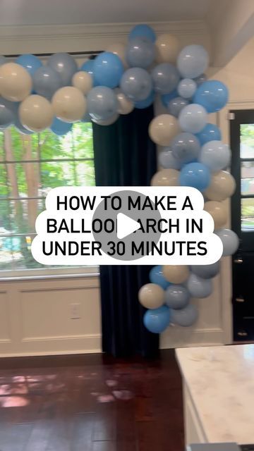 a balloon arch in the shape of a heart with text overlaying how to make a balloon arch in under 30 minutes