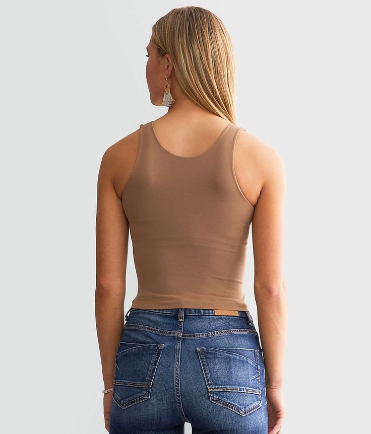 Free People Clean Lines Cropped Cami Tank Top - Brown M/L, Women's Strawberryroan Seamless high neck bust lined tank Bust measures 22 on size XS/S Body length 14 3/4 on size XS/S. 92% Nylon 8% Spandex. Machine wash cold gentle cycle. Non-chlorine bleach. Lay flat to dry.. Measurements: Bust -Fullest part of bust with arms at sides. Waist -Circumference of natural waist: above belly button below rib cage. Hips -Standing with feet together fullest part of hips. WOMEN'S TOP SIZE CONVERSION CHART Si Fitted Tank Vest With Built-in Bra, Versatile Sleeveless Crop Top With Built-in Bra, Second-skin Camisole For Layering, Fitted Racerback Crop Top With Medium Bust Support, Solid Sleeveless Crop Top For Layering, High Stretch Spring Camisole Tank Top, High Stretch Camisole Tank Top For Spring, Stretch Versatile Camisole, Second-skin Sleeveless Camisole For Spring