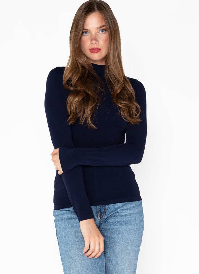 Our new modified mock neck long sleeve top! A great piece for layering under sweaters or jackets! Versatile Funnel Neck Top With Ribbed Cuffs, Fitted Fine Knit Long Sleeve Top, Casual High Stretch Tops For Fall, Trendy Knit Top For Fall Layering, Fitted Tops With Thumbholes For Fall, Fitted Long Sleeve Solid Top For Fall, High Stretch Long Sleeve Tops For Fall, Ribbed Turtleneck Sweater For Layering, Winter Long Sleeve Fine Knit Top