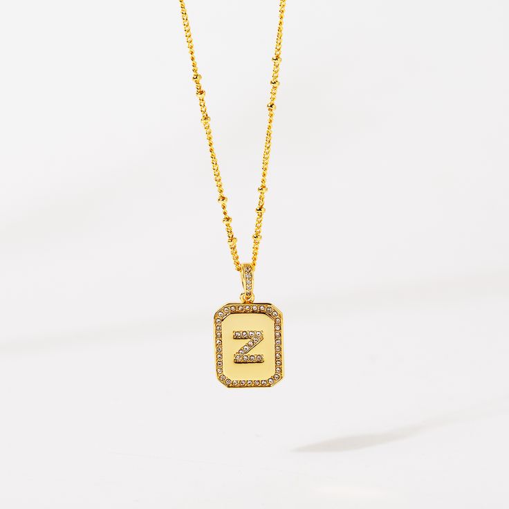 Gold Initial Pendant Necklace 18-20"– Think Goodness Gold Monogram Charm Necklace For Anniversary, Gold Initial Pendant Necklace With Name, Gold Initial Pendant Necklace For Anniversary, Gold Rectangular Pendant Name Necklace For Anniversary, Gold Initials Name Necklace, Gold Initial Pendant Charm Necklace With Initials, Gold Initials Necklace As Personalized Gift, Anniversary Gold Name Necklace With Rectangular Pendant, Gold Initial Pendant Charm Necklace For Anniversary