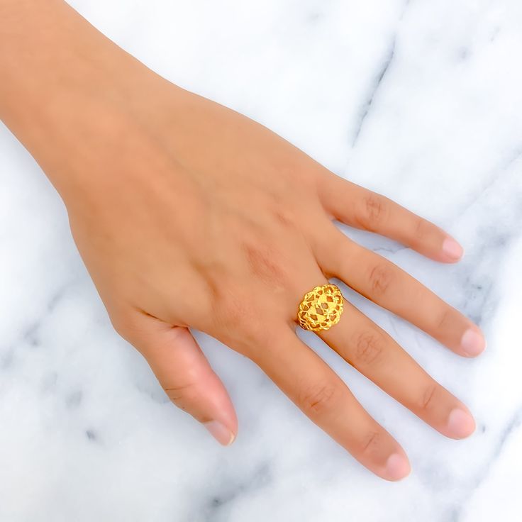 This ring, delicately crafted from 22k yellow gold and weighing 3.0 grams, displays an intricate design that exudes charm and sophistication. Available in size 7, with the option for resizing, it caters to diverse styles and preferences. Ideal for those who appreciate detailed artistry and the timeless allure of gold, this piece enhances any jewelry collection with its refined elegance and captivating detail. Product Details Gold Purity(karat): 22k Gold Weight(grams): 3.0 Item Finish: Yellow Gold Ring Size: ﻿7﻿ Ring Sizing Available: Yes // 22k Gold Filigree Ring With Intricate Design, Yellow Gold 22k Temple Jewelry Rings, 22k Yellow Gold Temple Jewelry Rings, Temple Jewelry 22k Yellow Gold Rings, 22k Gold Filigree Ring As Gift, 22k Yellow Gold Filigree Ring For Anniversary, Traditional Gold Oval Signet Ring, 22k Gold Yellow Ring As A Gift, 22k Yellow Gold Engraved Ring