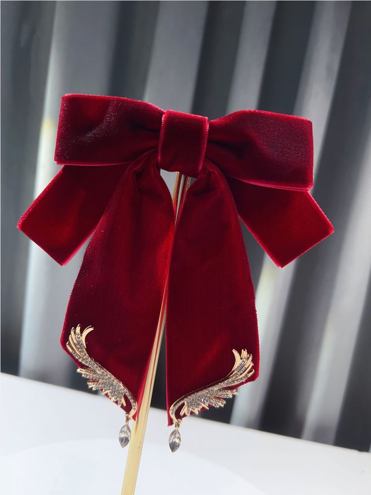 There is a pin on the back of the bow tie.  This price is for a bow tie only, others are not included.   	 		 			Size 			Free Size 		 		 			Length 			13 		 		 			Width 			14 Formal Butterfly Knot Bow, Elegant Satin Bow Hair Accessories For Evening, Red Bow With Butterfly Knot For Party, Elegant Red Bow With Butterfly Knot, Red Satin Bow For Party, Elegant Butterfly Knot Bow For Gift, Elegant Party Hair Accessory With Detachable Bow, Wedding Bow With Butterfly Knot, Elegant Evening Hair Accessories With Decorative Bow