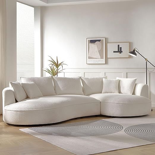 a large white sectional sofa in a living room