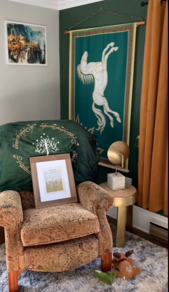 a room with a chair and pictures on the wall