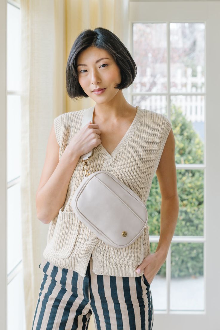 Lightweight? Check. Durable? Check. Versatile? Biiig check. With its multi-wear options and adjustable strap, this convertible bag is the epitome of essential. Style it four ways: crossbody, on the shoulder, around the waist as a belt bag, and across the torso. The Frankie's chic silhouette and plenty of pocket space make it your next pick for your bag BFF. Details: 9” long x 6.5” height x 2” wide Includes a solid strap that adjusts from 32”-52” end to end The front magnetic pocket is 9” long x Versatile Belt Bag With Adjustable Strap For On-the-go, Beige Crossbody Belt Bag For On-the-go, Chic Everyday Crossbody Belt Bag, Versatile Belt Bag With Detachable Strap, Versatile Satchel Belt Bag For On-the-go, Versatile Everyday Rectangular Belt Bag, Versatile Belt Bag With Adjustable Strap For Travel, Chic Everyday Belt Bag With Adjustable Strap, Versatile Everyday Crossbody Belt Bag