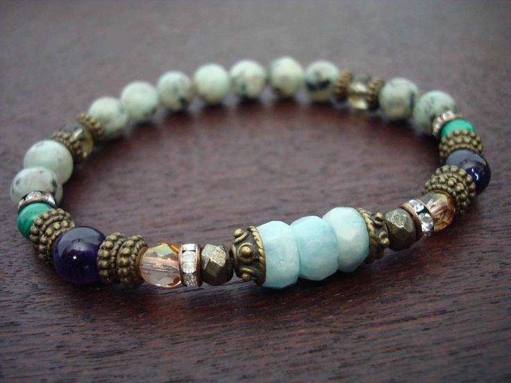 "women's aquamarine spiritual guidance mala bracelet made from grade A+ aquamarine, amethyst, malachite, smoky quartz, jasper, czech crystal, and malaysian rhinestones. aquamarine is known as a stone of courage, inner peace, self-love, and great power. it provides protection energetically, and is said to attract guardian angels. it is an excellent stone for meditation, brings hope and good luck, and has been used to release anger and fear. it assists with communication issues, is associated with Adjustable Aquamarine Bracelets With Natural Stones, Spiritual Aquamarine Turquoise Bracelets, Aquamarine Turquoise Bracelet For Healing, Spiritual Turquoise Aquamarine Bracelets, Turquoise Aquamarine Healing Bracelet, Adjustable Aquamarine Beaded Bracelets, Adjustable Aquamarine Beaded Bracelets As Gifts, Adjustable Aquamarine Beaded Bracelet As Gift, Adjustable Aquamarine Beaded Bracelets With Natural Stones