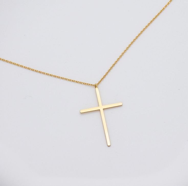 Whether you're treating yourself or gifting it to a loved one, our necklace is a timeless piece. Elevate your jewelry collection with this elegant and heartfelt creation, and wear your faith with grace and style. 🙏✨ Finish: Gold Dipped Adjustable Chain 15.5 to 17.5 inches Pendant size: 3.5cm*2.3cm This necklace is ready to ship in 1 - 2 business days To ensure lasting beauty and shine, follow these simple care instructions: * Avoid Contact with Water: Remove your necklace before swimming, showering, or participating in water-related activities. * Avoid Harsh Chemicals and Clean Gently: If your necklace needs cleaning, use a soft, damp cloth to gently wipe away any dirt or oils. Avoid abrasive materials that could scratch the delicate gold surface. * Avoid Abrasive Surfaces: Be mindful of Minimalist Cross Jewelry For Anniversary, Mother's Day Gift Cross Pendant Necklace, Minimalist Cross Necklace For Anniversary, Dainty Cross Necklaces For Mother's Day, Dainty Cross Necklace For Mother's Day, Valentine's Day Cross Pendant Jewelry Gift, Valentine's Day Gift Cross Pendant Jewelry, Elegant Cross Charm Necklace As Gift, Minimalist Cross Pendant Jewelry Gift