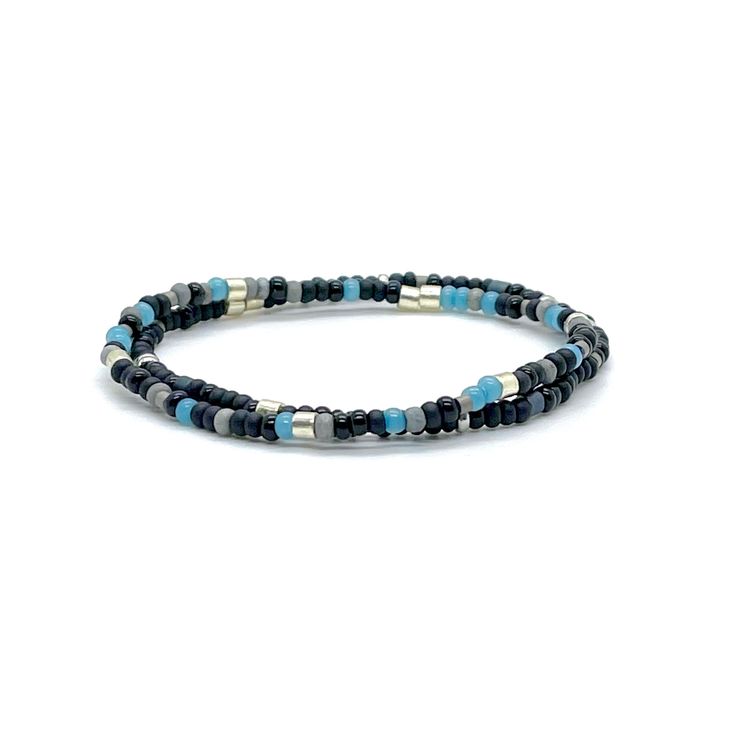 Angle Band: Flat woven; 3/8"w; glass seed beads; sterling silver clasp & 1" extender chain. Bracelet Strand A: Stretch style; 6mm gunmetal coated lava beads; 4mm natural dumortierite beads; glass seed beads; finished with a 5mm stainless steel bead. Bracelet Strands B & C: Stretch style; 3mm glass seed beads. Perfect solo or stacked. Bracelet Size Guide Adjustable Gunmetal Bracelet For Everyday, Adjustable Heishi Bead Jewelry With Black Beads, Modern Adjustable Stretch Bracelet With Round Beads, Adjustable Gunmetal Beaded Jewelry, Adjustable Beaded Gunmetal Jewelry, Adjustable Minimalist Gunmetal Bracelet, Adjustable Silver Single Strand Beaded Bracelets, Adjustable Blue Beaded Bracelets With Black Beads, Modern Adjustable Beaded Bracelets With Tiny Beads