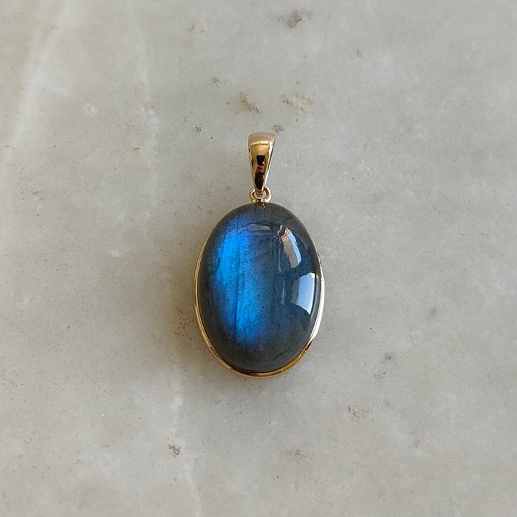 This stunning Pendant is set in 14k Solid Yellow Gold with Natural Labradorite with utmost precision. It is a unique gemstone Pendant for nearly every occasion and is completely hassle-free jewelry. ITEM DETAILS: * GEM: Labradorite * GEM SIZE: 13X18mm * GEM SHAPE: Oval * Gem weight: 13.98 carats * Gold Purity: 14KT (58.33% approx.) * Gold Weight: 0.59 gram big loop * Total Weight of the Pendant: 3.39 gram The Gold purity is guaranteed and it comes with authentic 14KT gold hallmark. Since my item Pendant Jewelry Gold, Energy Drain, Faberge Jewelry, Psychic Attacks, Bezel Jewelry, Handmade Jewelry Box, August Birthstone, Labradorite Jewelry, Bezel Pendant