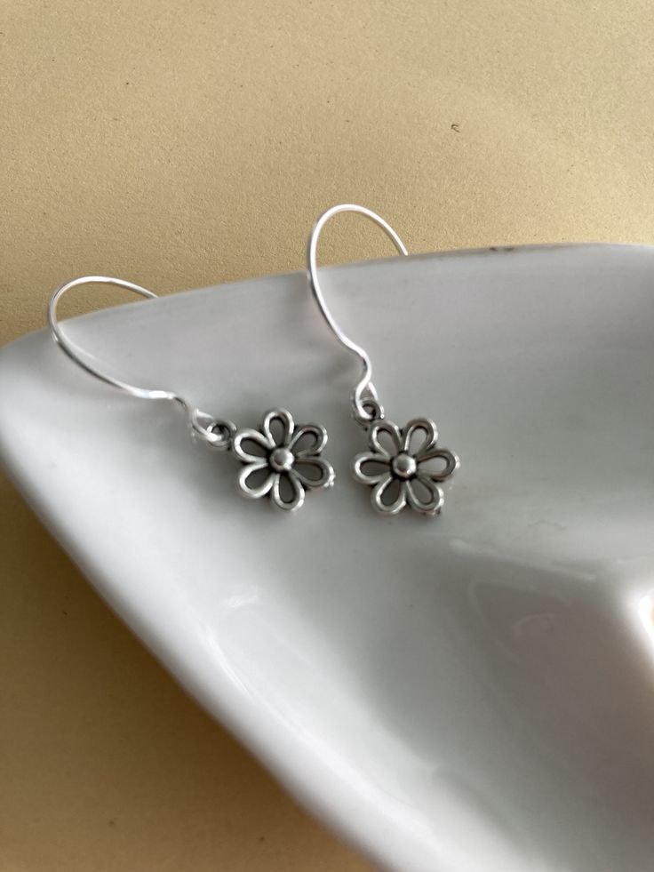 Everyday flower earring. Open Daily design. Super light weight. Measure 3/8 inch plus ear wire. Flower tibetan silver. Ear wires are Sterling silver fill. Silver Flower Earrings For Pierced Ears, Silver Flower Earrings With Lever Back Ear Wires, Silver Flower Charm Earrings, Silver Flower Pendant Earrings With Charm, Delicate Sterling Silver Flower Earrings With Ear Wire, Silver Hypoallergenic Flower Earrings, Bohemian Silver Flower Earrings, Silver Bohemian Flower Earrings, Flower Earrings With Ear Wire As Gift