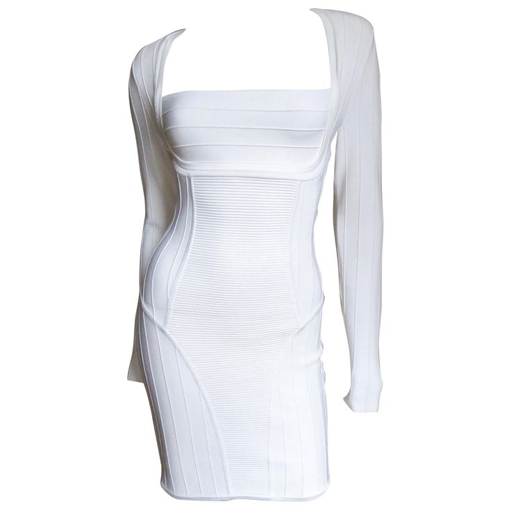 A fabulous white body conscious bandage dress from Pierre Balmain. It has long sleeves, a square cut neckline, and fabulous ribbed panels accentuating the waist and bust. It is unlined with a gold Balmain inscribed back zipper and small pads at the shoulder. Stunning! Fits sizes Extra Small, Small. Marked French size 36. Bust 33-36" Waist 26-29" Hips 34-36" Sleeves 24" Length 33" Balmain Dress Evening Gowns, Designer Things, Balmain Jacket, Balmain Fashion, Balmain Clothing, Balmain Dress, Preformance Outfits, Fantasy Wardrobe, White Bodycon