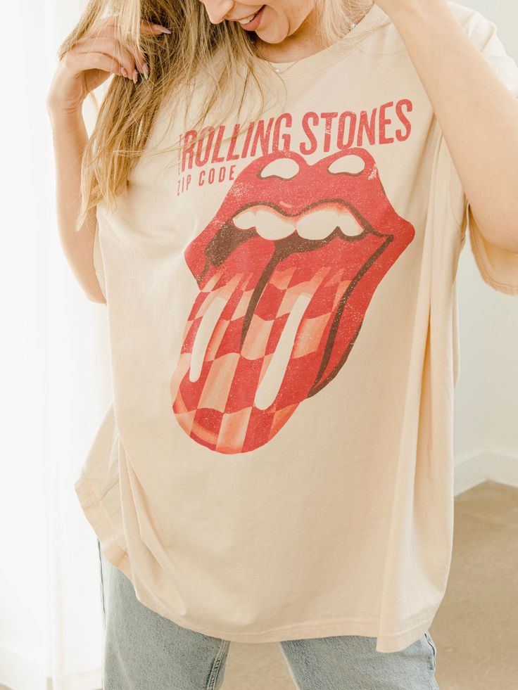 Your new favorite vintage style band tee. Show your unique style with this oversized show-stopper. The details: 100% Cotton Oversized Fit One Size Fits Most Officially Licensed via Bravado for The Rolling Stones Trendy Oversized Tops For Concerts, Soft-washed Tops For Spring Concert, Oversized Band Merch Tops For Summer, Oversized Band Merch T-shirt For Spring, Rock And Roll Screen Print Summer Tops, Rock And Roll Graphic Print Tops For Spring, Rock And Roll Graphic Print Spring Tops, Oversized Band Merch Tops With Graphic Design, Graphic Tee For Concerts, Soft-washed