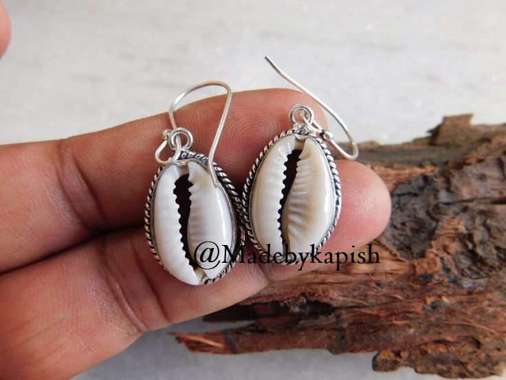 925 sterling silver Cowrie shells earring* Money cowrie shell Earrings* Cowrie Seashell Jewelry* earring for women* dangle earring* dangle* Earring length approx : 42 mm Cowrie size approx : 18 X 12 mm Metal - 925 sterling silver Weight of Earring : 6.24 Gm Metaphysical Properties of Cowrie : Minimalist in style but with a casual, beachy feel these natural cowrie shells have been suspended from sterling silver hooks. Lightweight and simple they are perfect for adding a touch of the beach to your Cowrie Shell Earrings, Cowrie Shell Jewelry, Cowrie Shells, Mermaid Jewelry, Seashell Jewelry, Earring For Women, Jewelry Earring, Cowrie Shell, Shell Jewelry