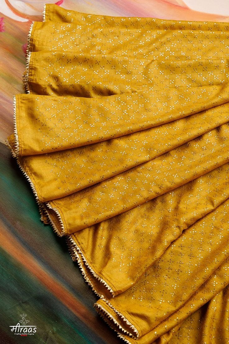 "Gorgeous Mustard Tussar Silk Saree with allover dense Mukaish Embroidery. The saree is a class apart piece of art & an Heirloom Collectible!! Beautiful supple Tussar Silk saree has been adorned with innumerable stars of Mukaish. This is a very high quality handcrafted Mukaish saree, unlike most of work that is now available in the market. Each dot of Mukaish has been finely rubbed to make them settle properly in the fabric & invoke beautiful lustre. The saree is dyed a lovely shade of Mustard Yellow & finished with Gold Zari Gota Lace (tested & pure). This saree is now MADE ON ORDER and will take maximum 13 weeks to get made after placing the order. Message us if you wish to customise the colour of the saree to your preference. THE SUSTAINABILITY QUOTIENT (TSQ): 1. Very fine quality herit Gold Chanderi Pre-draped Saree With Gota Work, Festival Chanderi Pre-draped Saree With Gota Work, Festive Bollywood Pre-draped Tussar Silk Saree, Designer Art Silk Pre-draped Saree With Zari Work, Yellow Pre-draped Saree With Resham Embroidery, Gold Pre-draped Dola Silk Saree With Dupatta, Semi-stitched Gold Pre-draped Saree With Dupatta, Gold Art Silk Pre-draped Saree With Resham Embroidery, Traditional Katan Silk Pre-draped Saree For Party