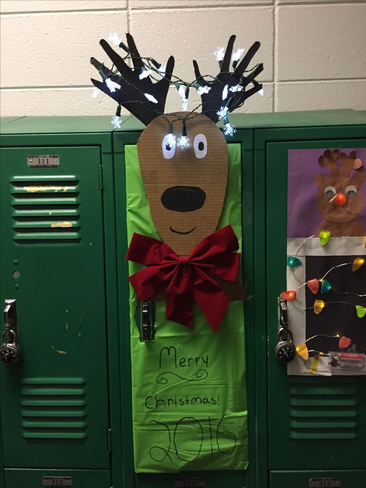 a green locker with christmas decorations and reindeer's head hanging on the front door